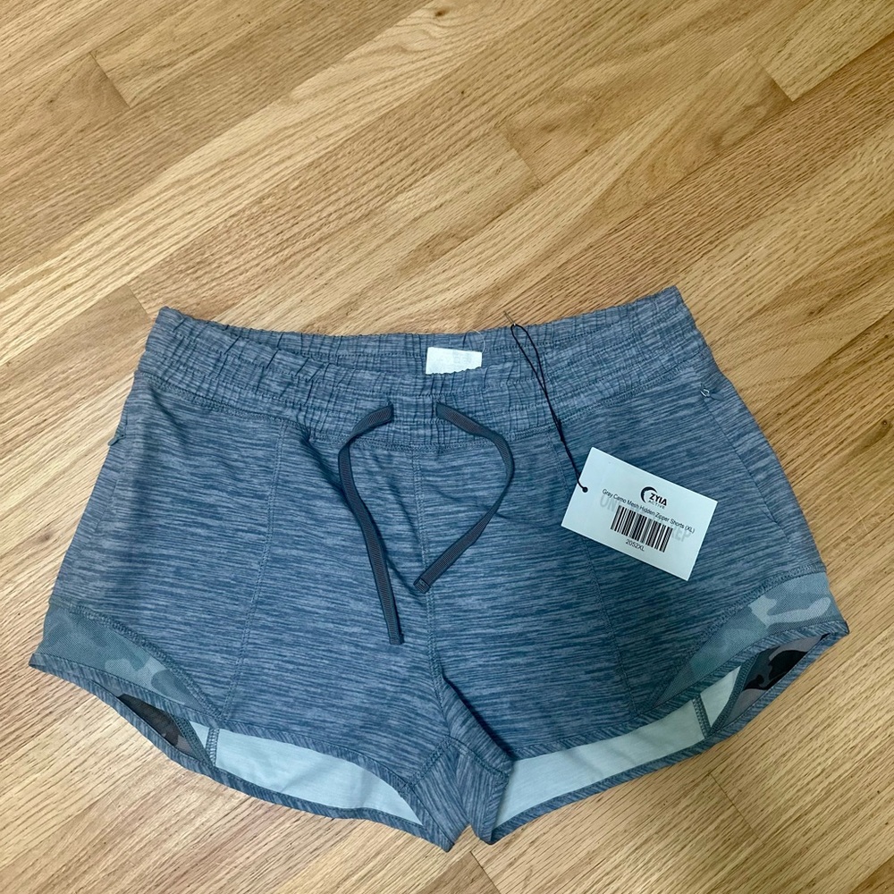 ZYIA Gray camo mesh hidden zipper shorts.